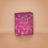 Pink gift bag, white rabbit, red and white striped leaf pattern, DREAMS SMALL WORLD BIG DREAM, grey rope handle details Picture